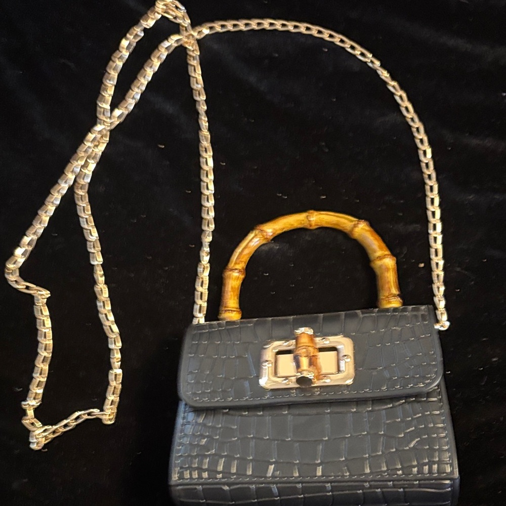 Elegant Black Mini Bag with Bamboo Handel and long gold chain